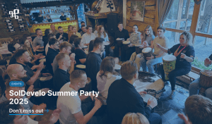Employees taking part in a drumming workshop during the company’s team-building summer event in Sopot.